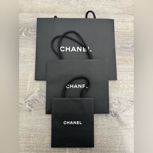 Three Chanel paper bags